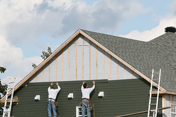 Professional Siding Replacement technician working in Old Westbury, NY